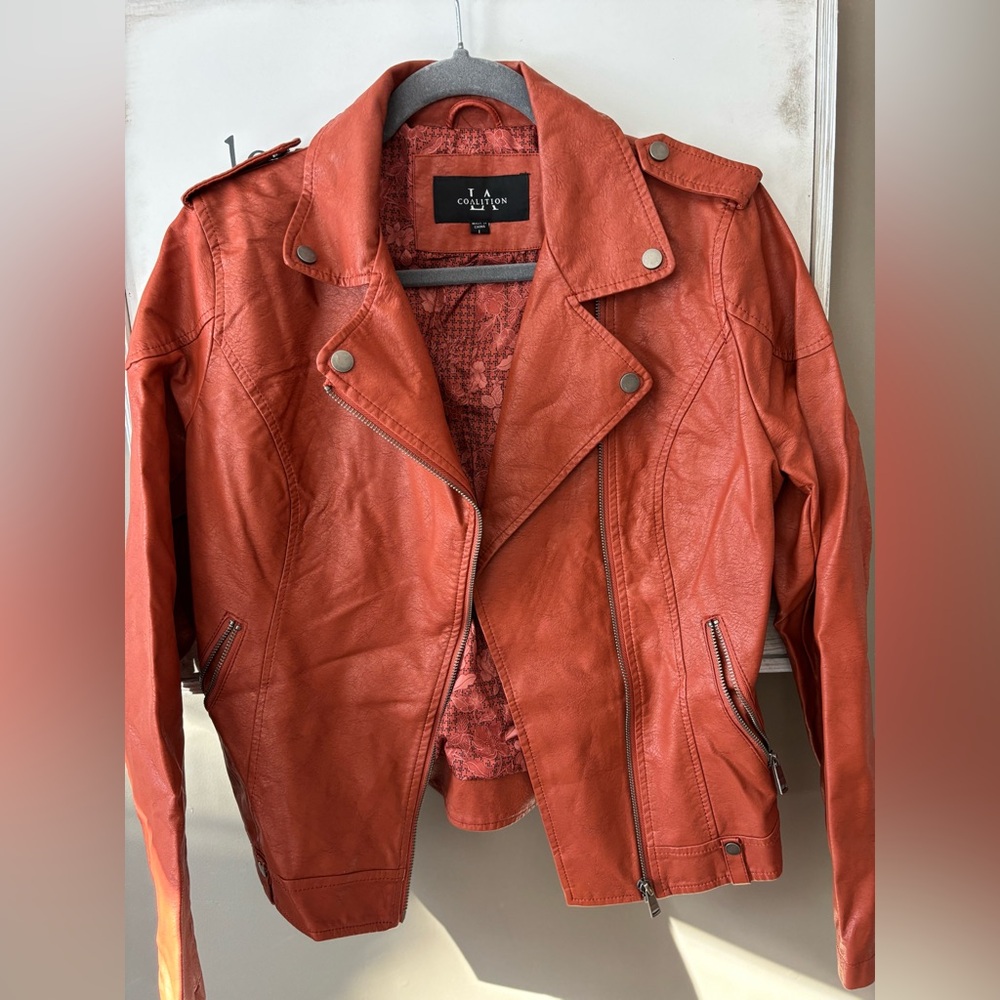 Leather Moto Jacket in a Beautiful Red Orange Cayenne.
Fully Lined. Like New